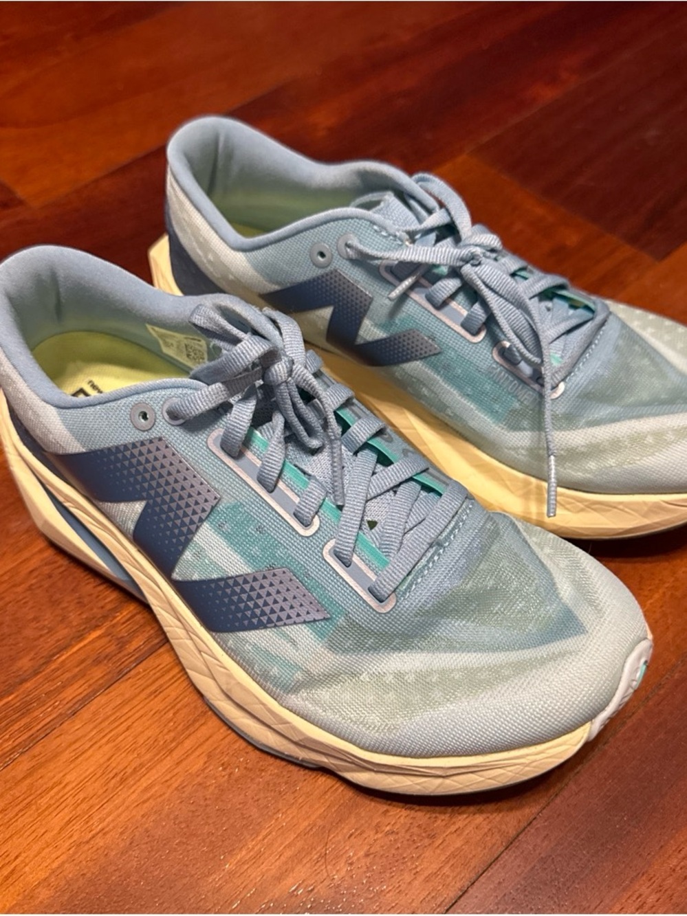 New Balance Fuel Cell Rebel V4 Women's Light Blue and Navy Running Sneakers